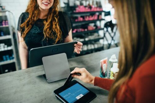 waitress scanning restaurant gift card